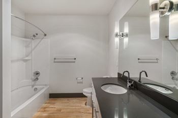 a bathroom with a toilet sink and bathtub